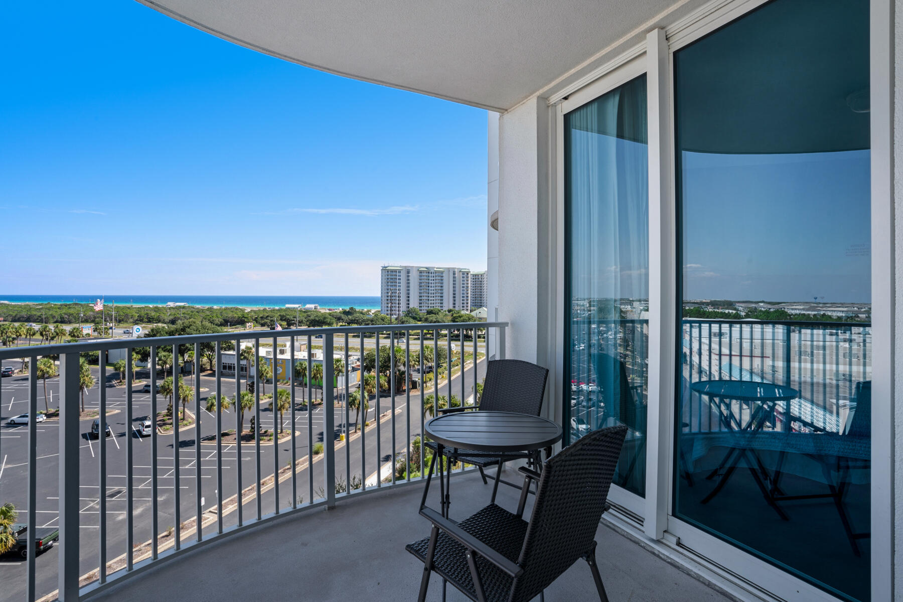 a view of a balcony with chair and wooden floor