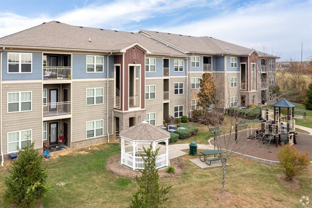 a front view of a building with outdoor seating