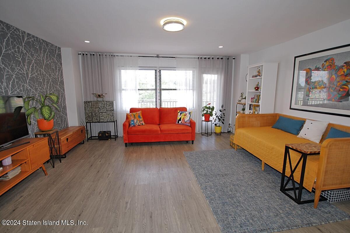 a living room with furniture and a window