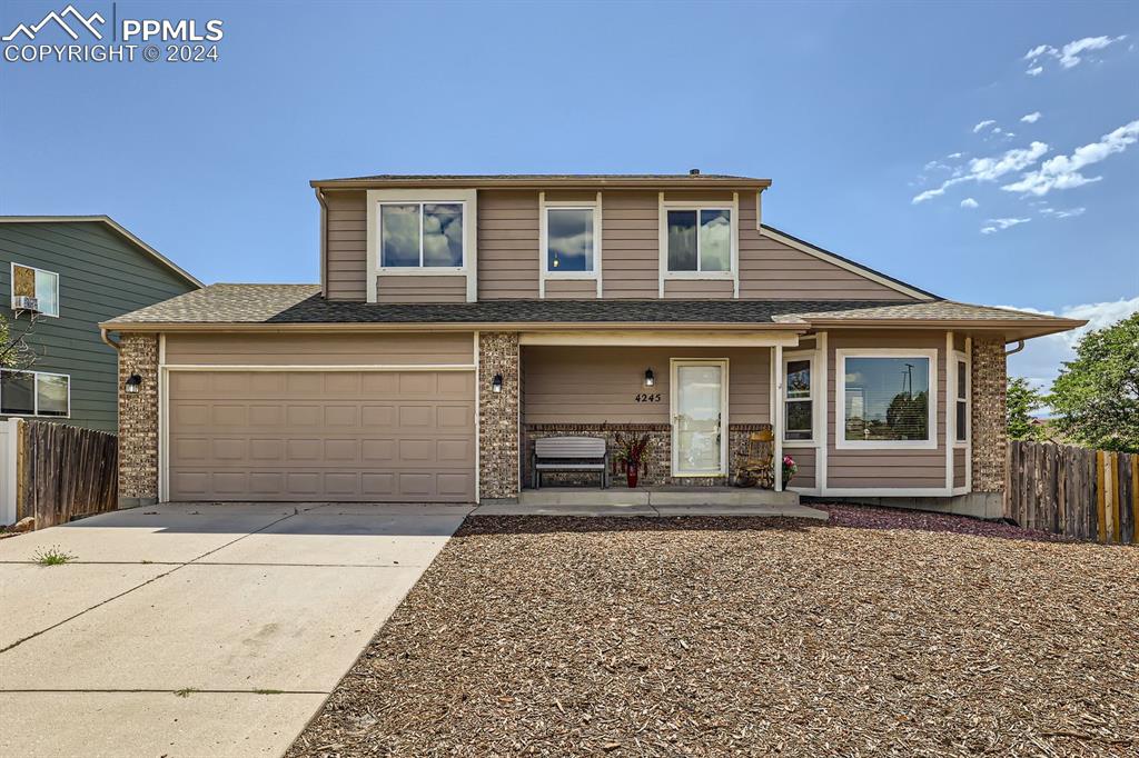 a front view of a house with yard