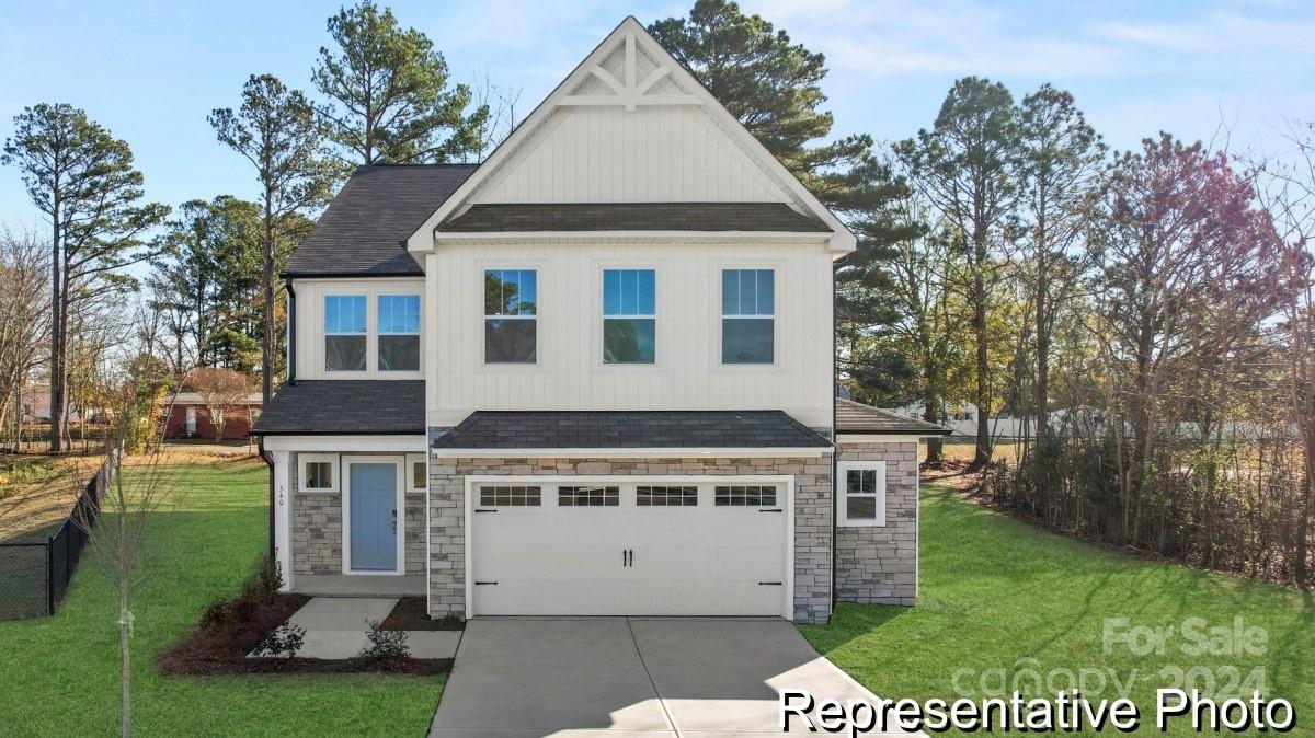 a aerial view of a house with a yard