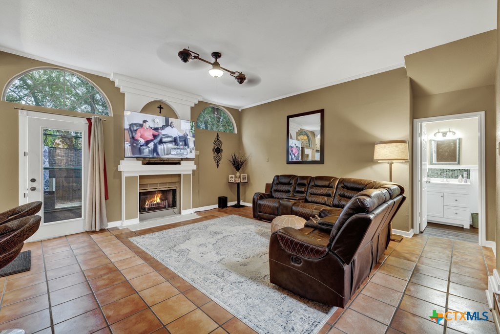 a living room with furniture and a fireplace