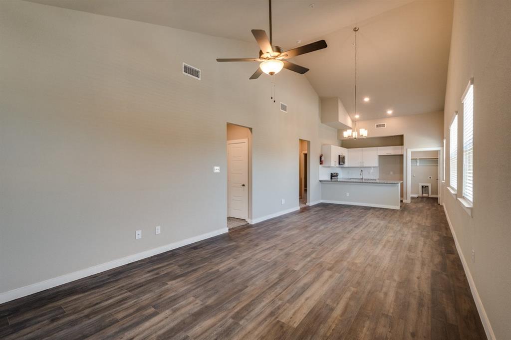 a view of a livingroom with a kitchen