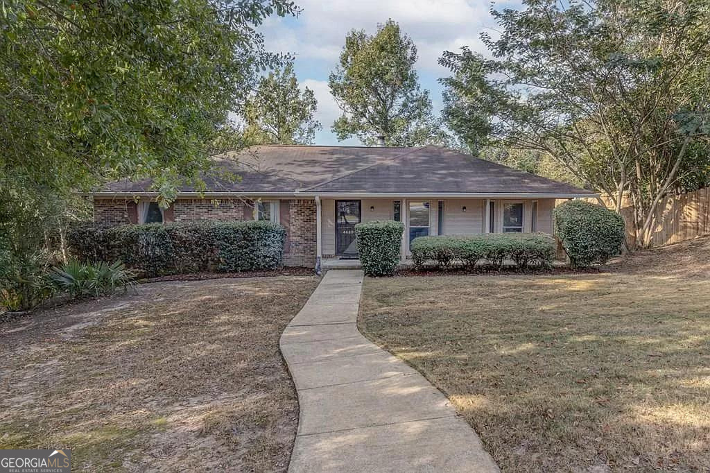 a house with trees in the background