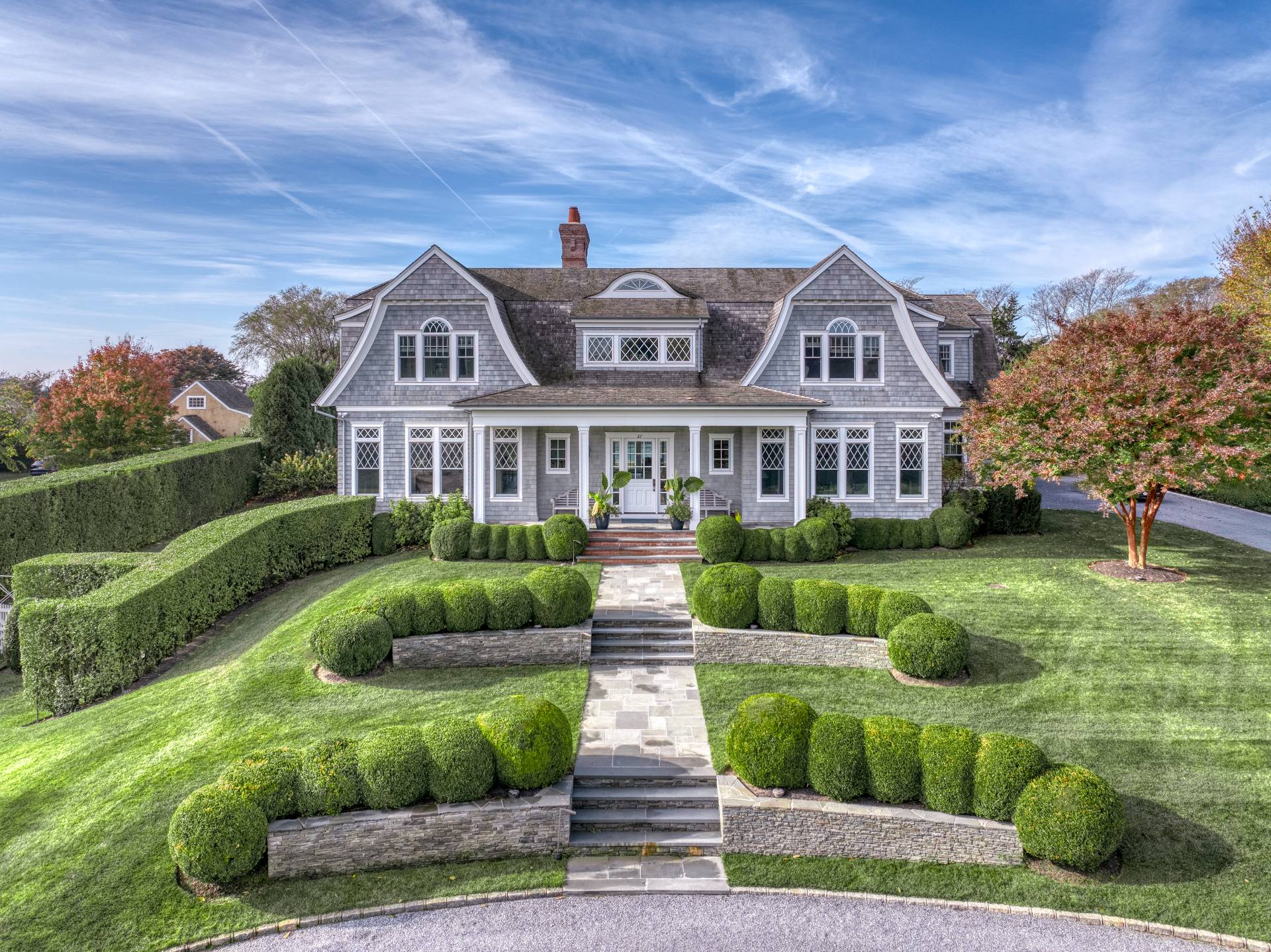 a front view of house with yard and green space