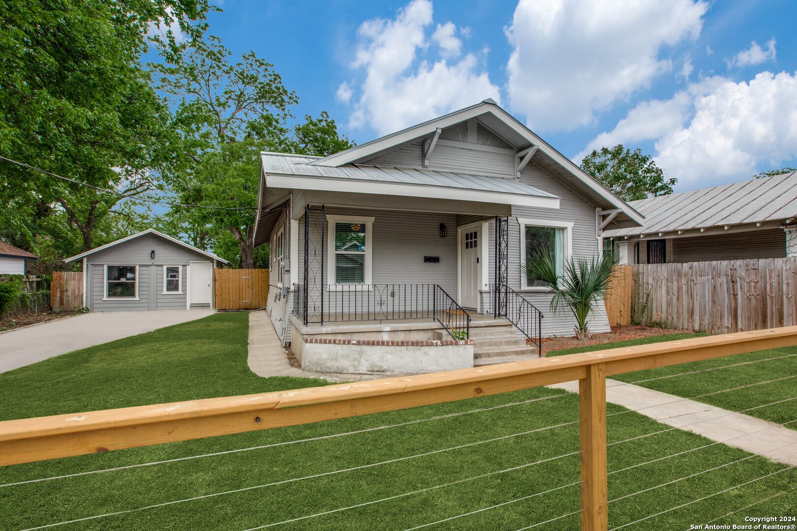 a view of a house with a yard patio and a yard