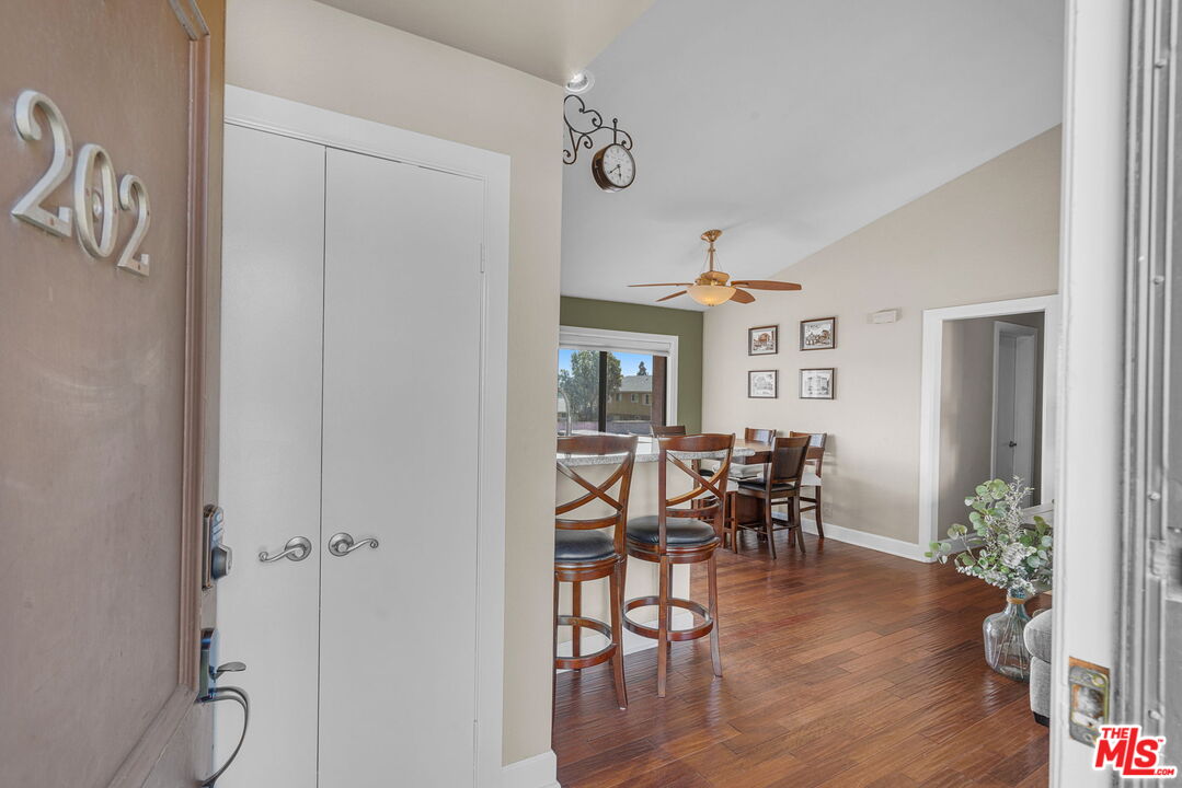 a view of a dining room with furniture window and wooden floor