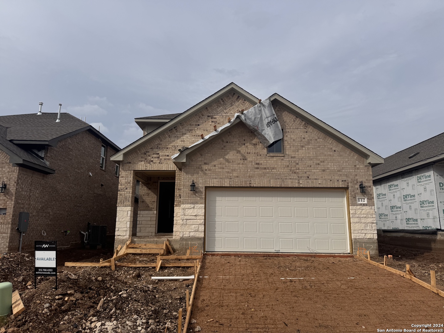 a front view of a house with yard