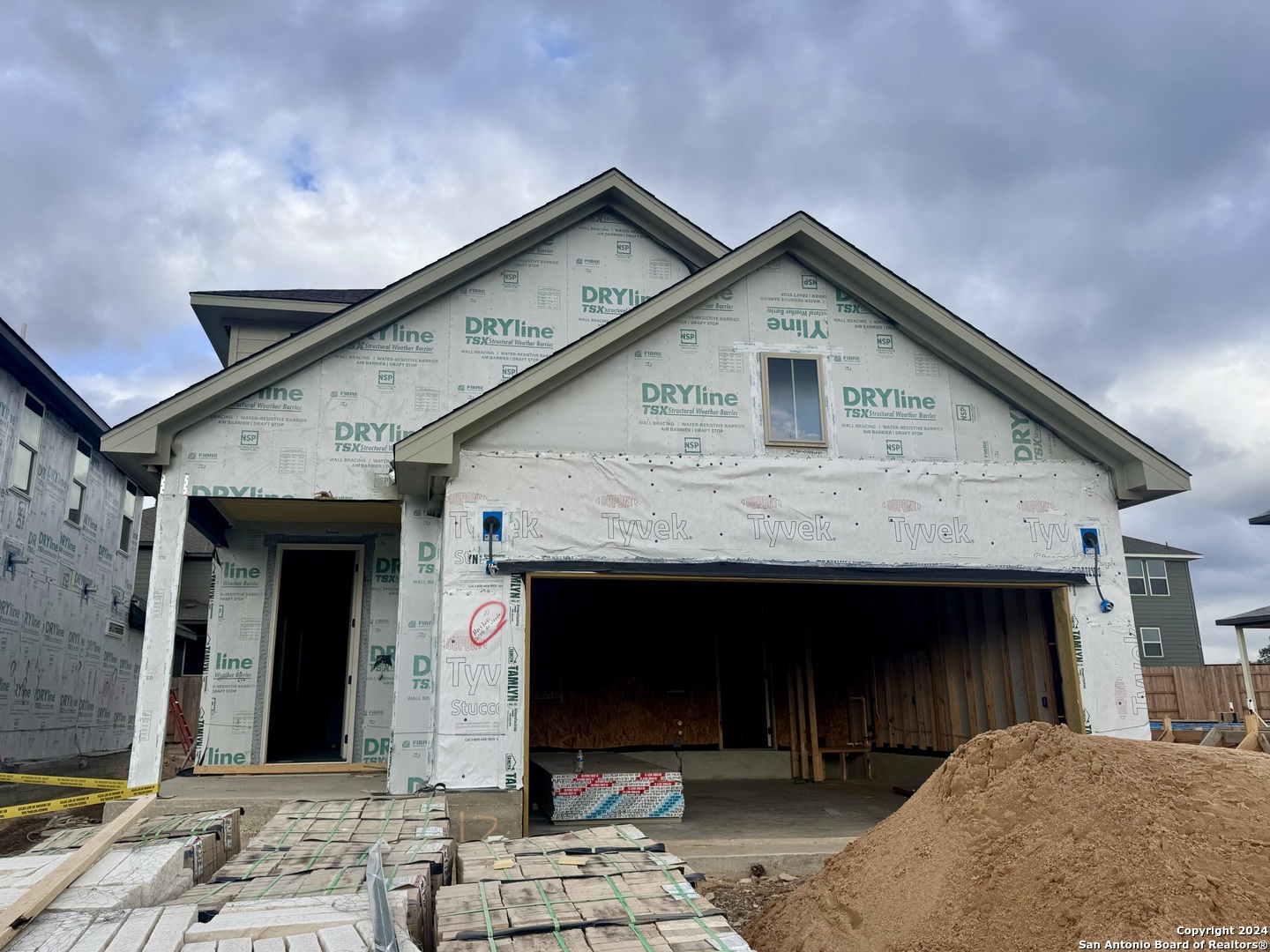 a front view of a house with yard