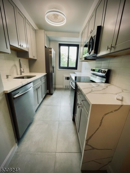 a utility room with a sink a washer and dryer