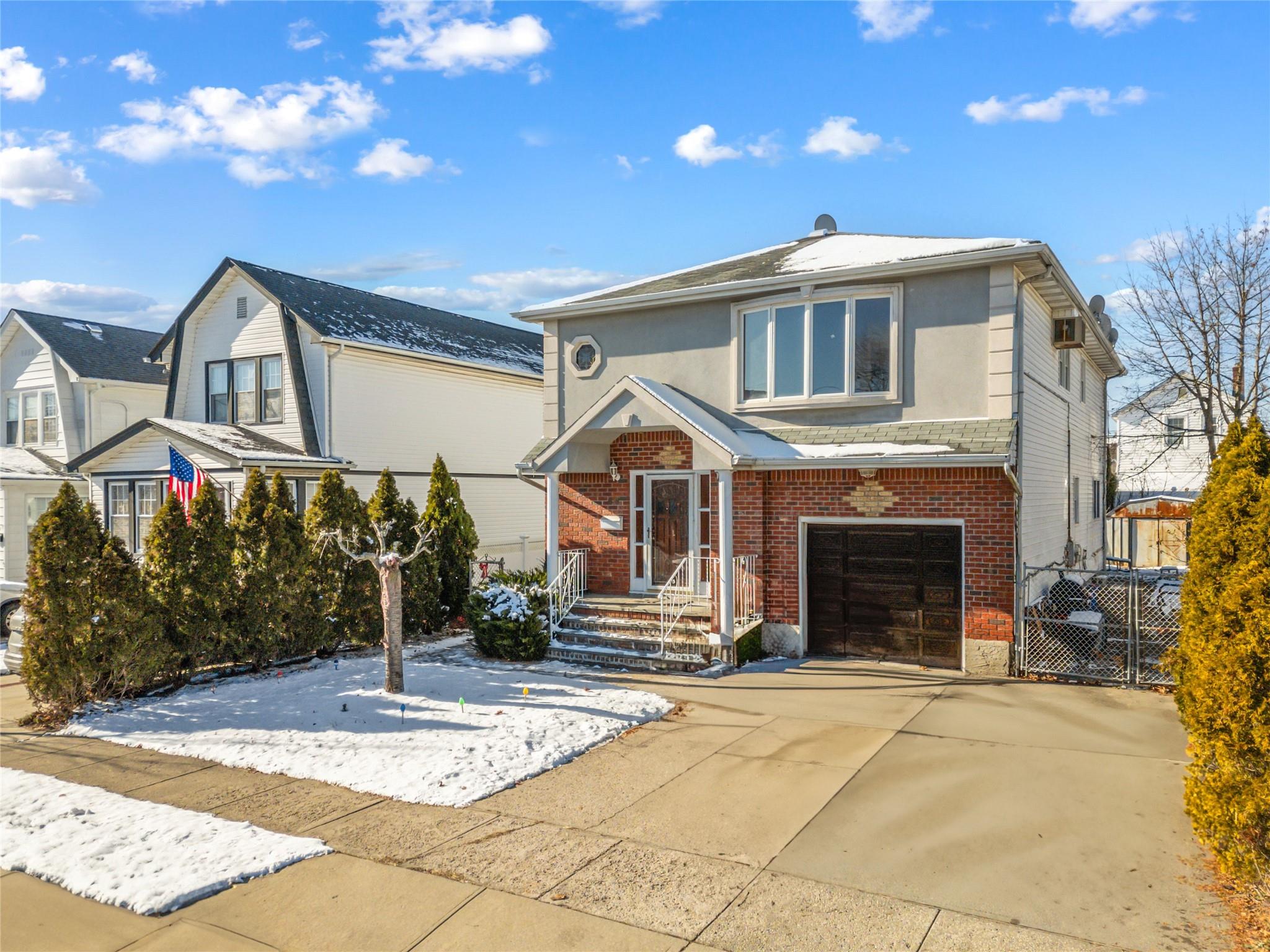 View of property with a garage