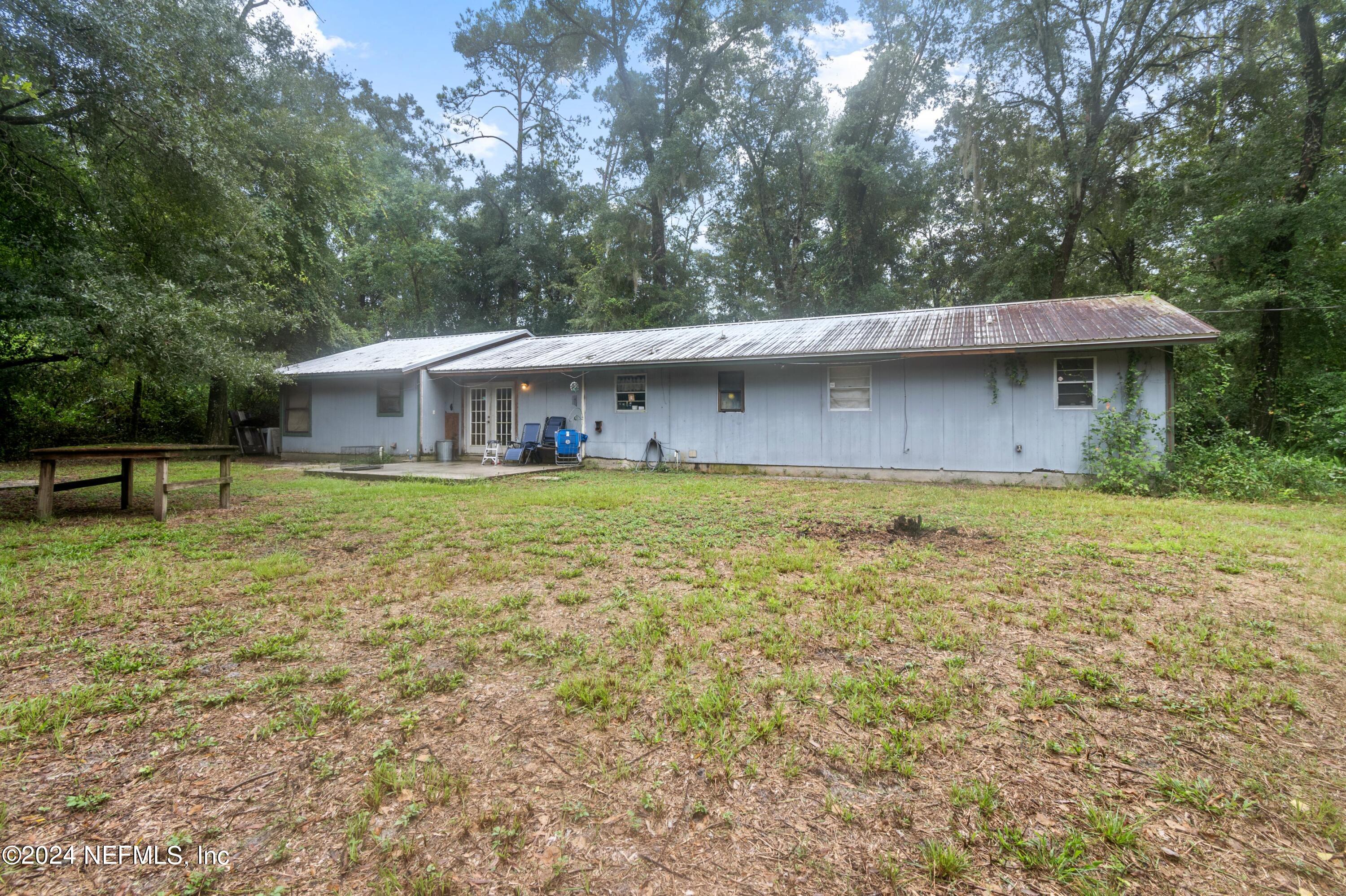 a view of a house with a yard porch and sitting area