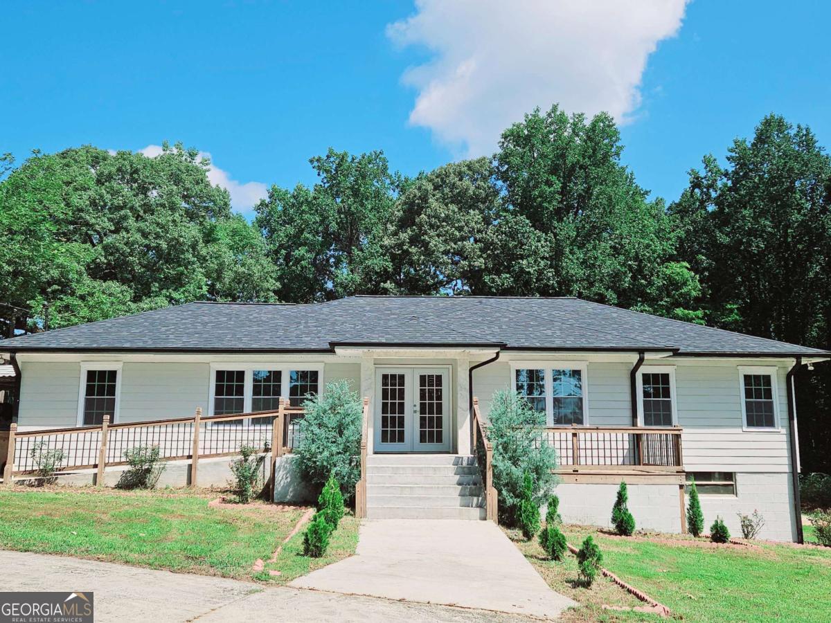 front view of a house and a yard