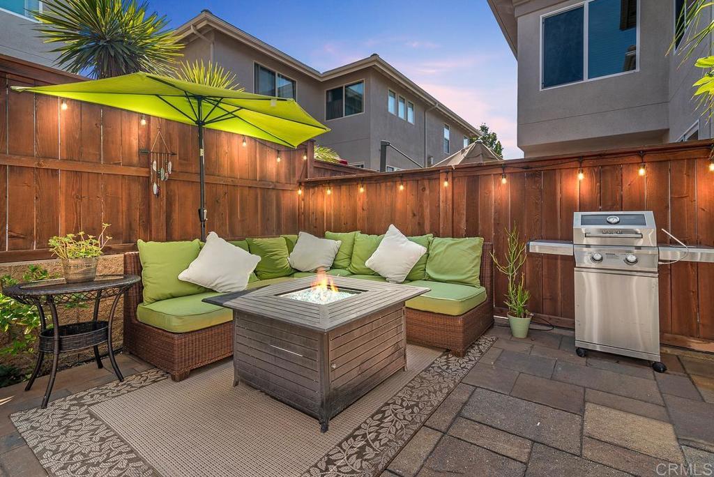 a view of a chairs and table in the patio