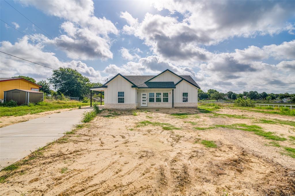 a view of house with backyard and entertaining space