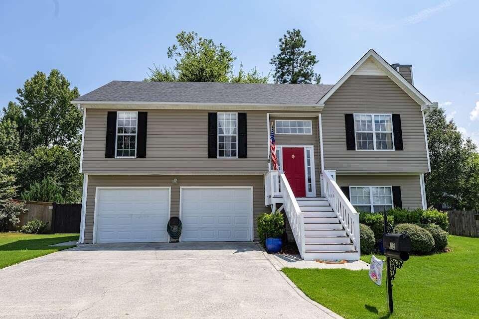 a front view of a house with a yard