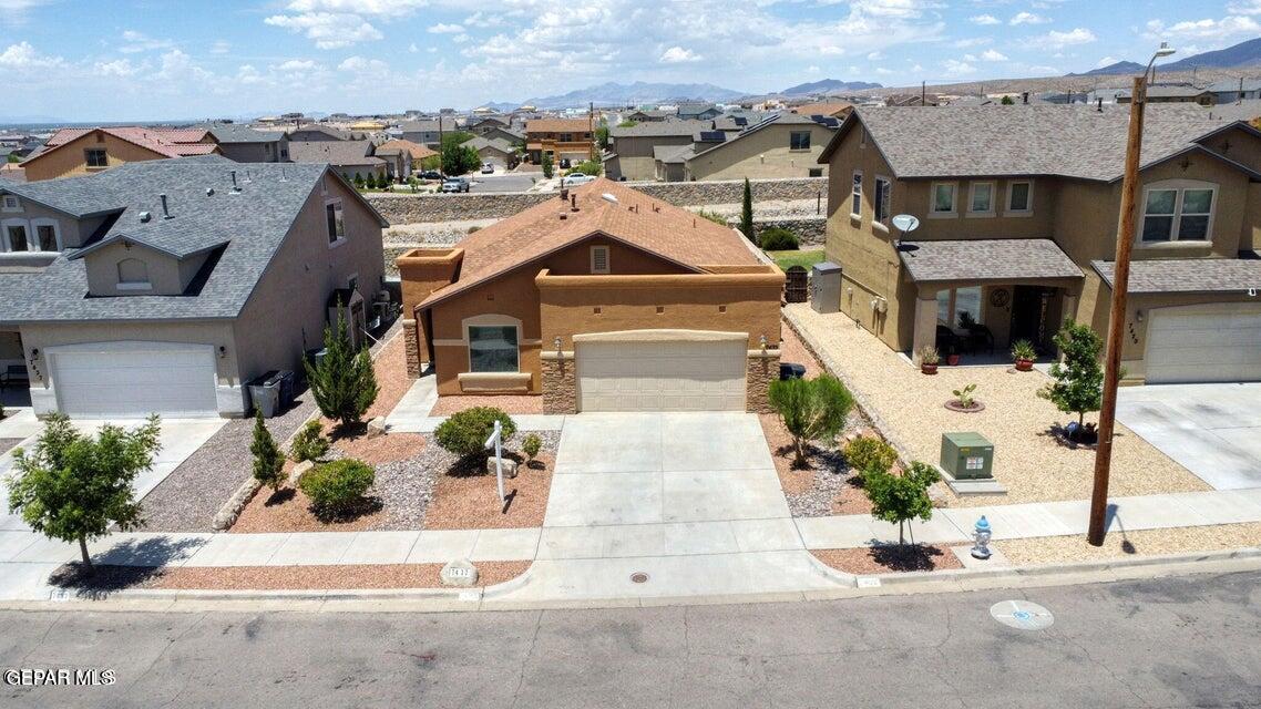 an aerial view of a house with a garden