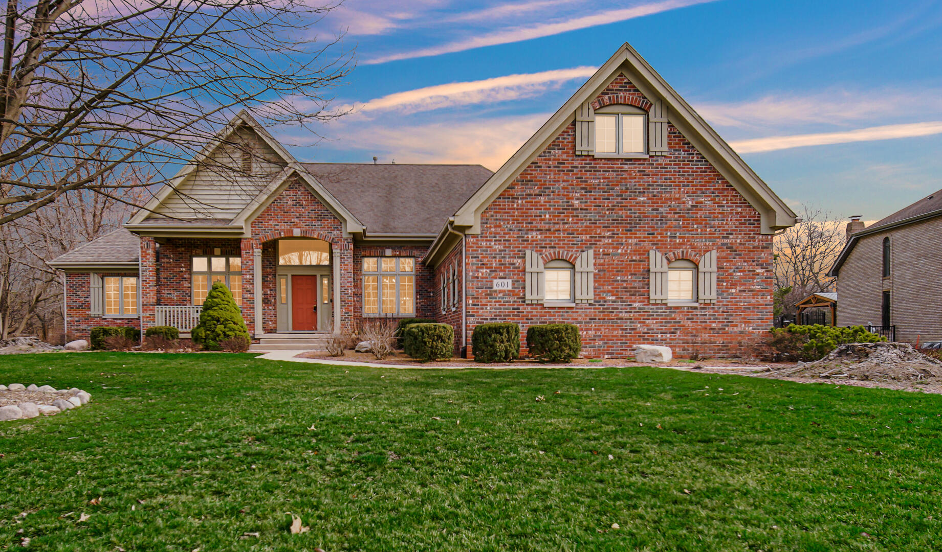 a front view of a house with a yard