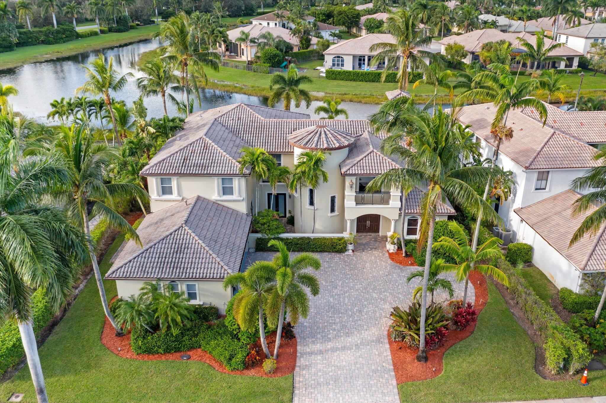 an aerial view of multiple houses with yard