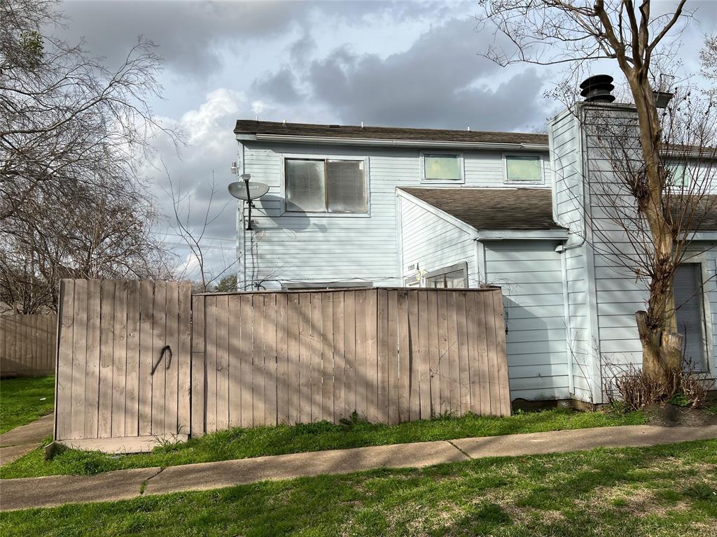 a front view of house with a garden