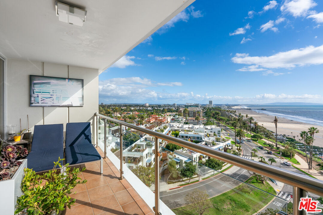 a view of a balcony with furniture