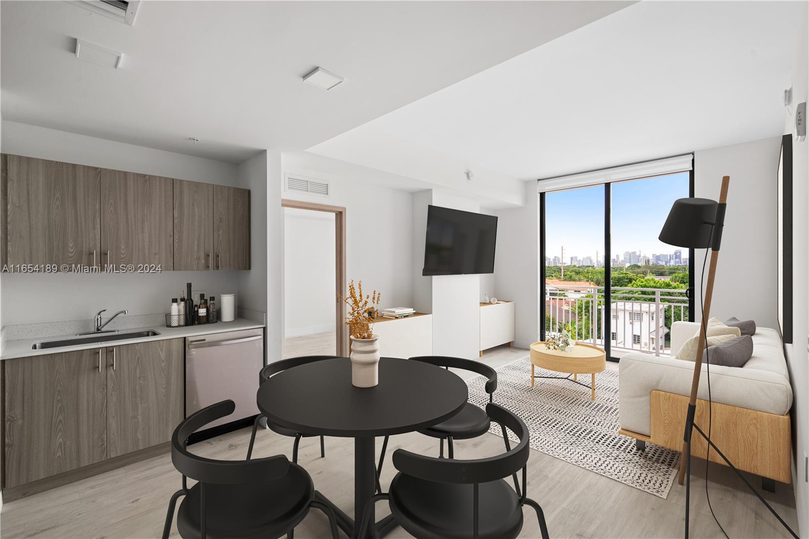 a living room with furniture a flat screen tv and a floor to ceiling window