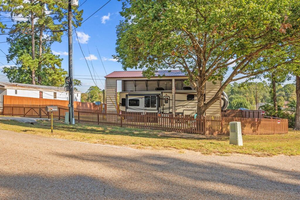 a view of the house with a yard