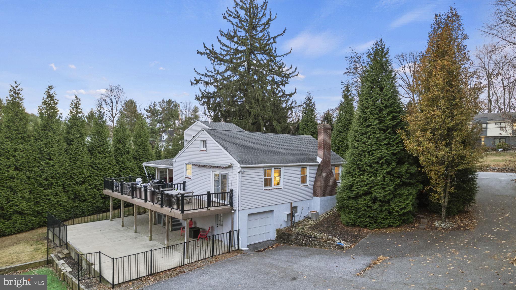 a house with trees in the background