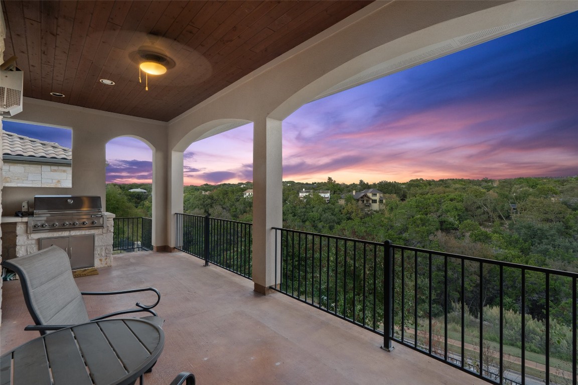 a view of a chairs and table in patio