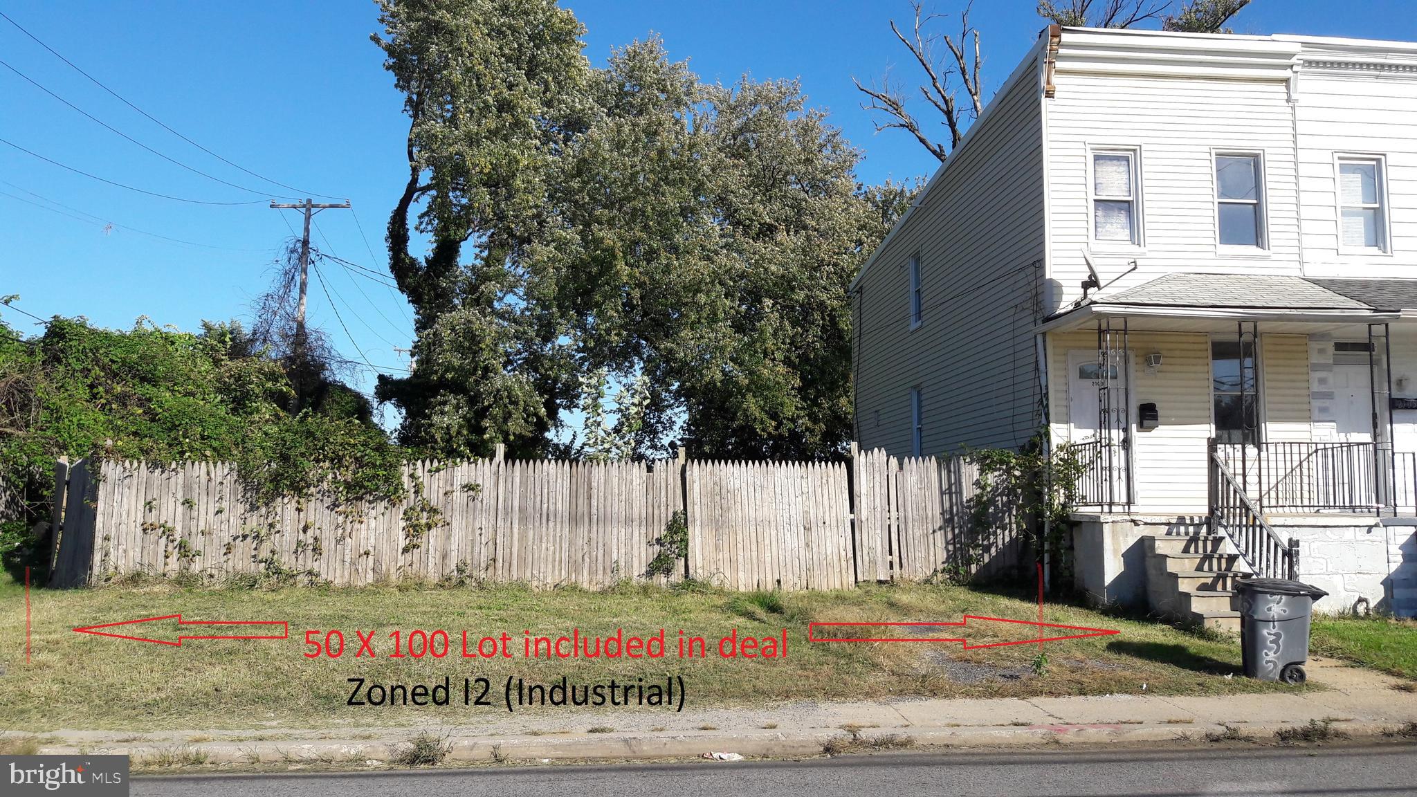 a view of a brick house with a yard