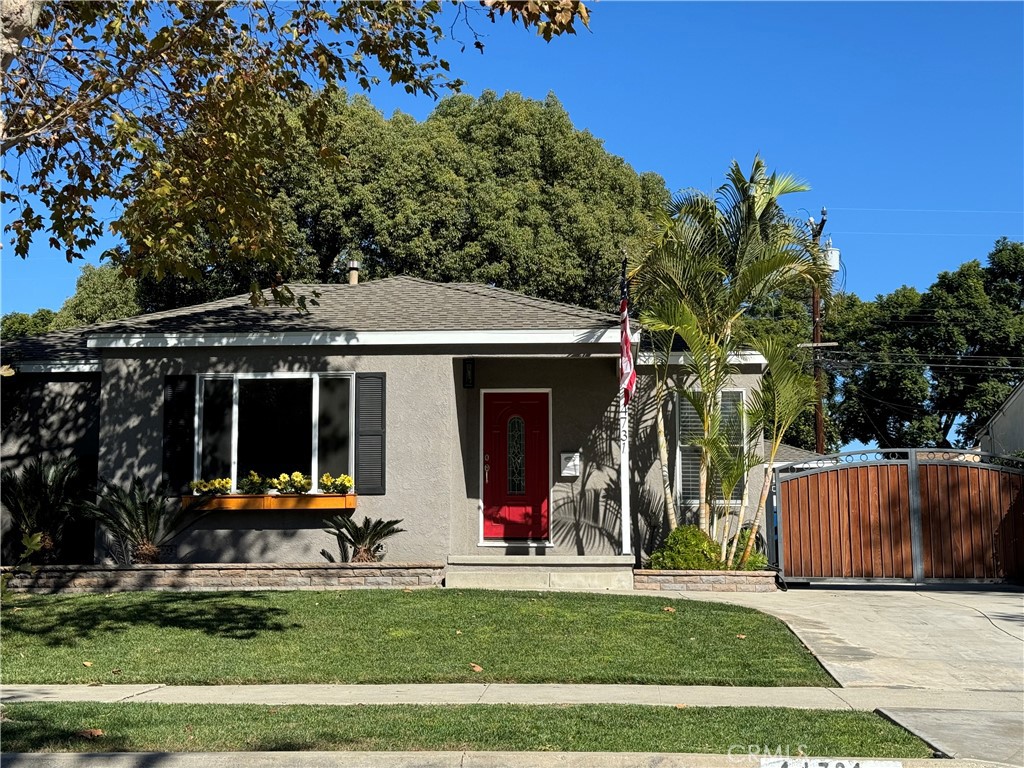 a view of a house with backyard porch and sitting area