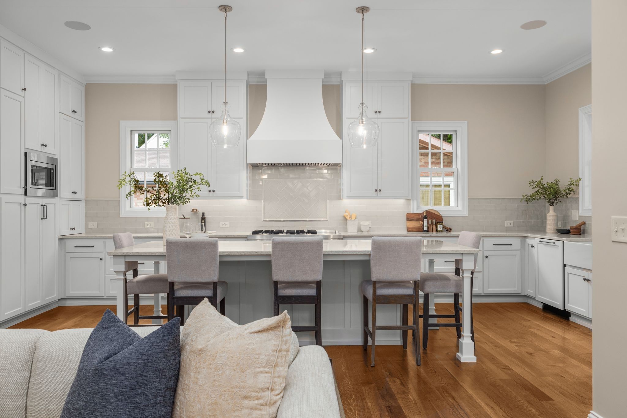 The heart of the home, this kitchen features a massive island with ample countertop seating, ideal for weekly meal prep, everyday casual dining with the family, evening homework reviews, and the occasional treat of midnight cookies and milk.