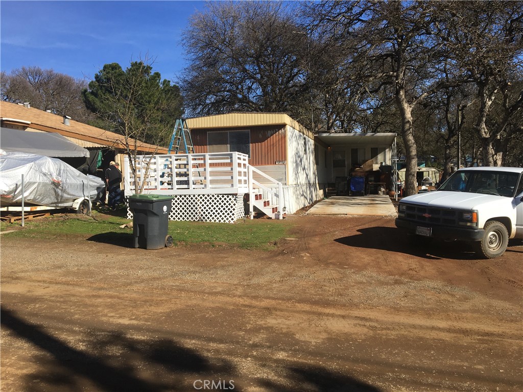 a view of a car park in front of a house