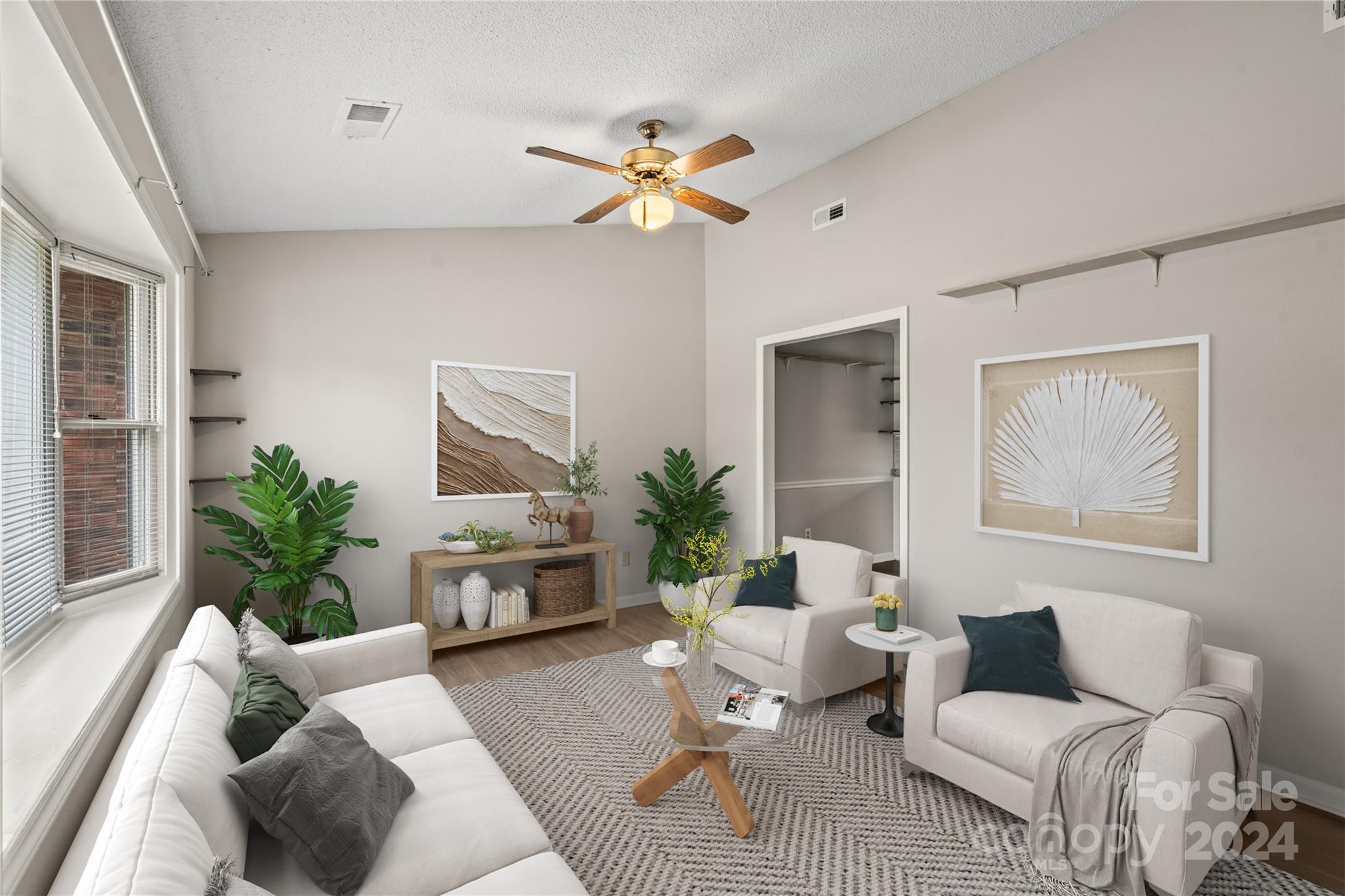 a living room with furniture and window