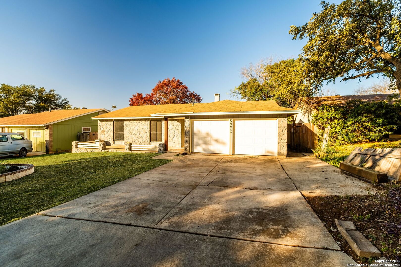 a front view of a house with a garden and patio