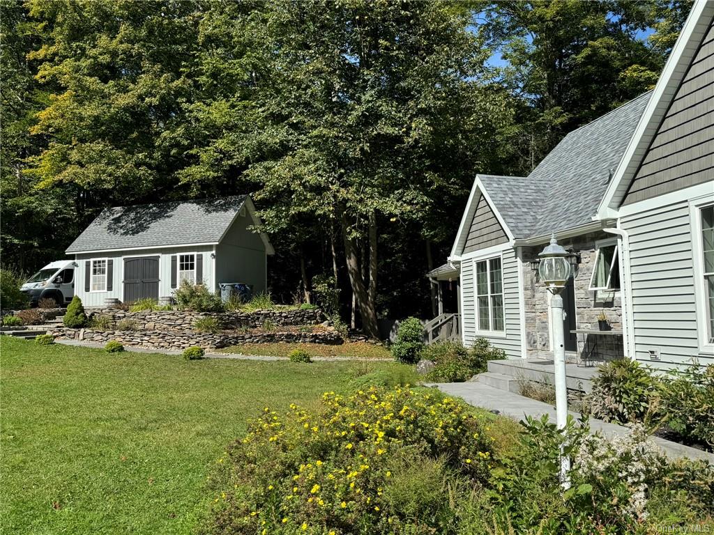 a front view of a house with garden