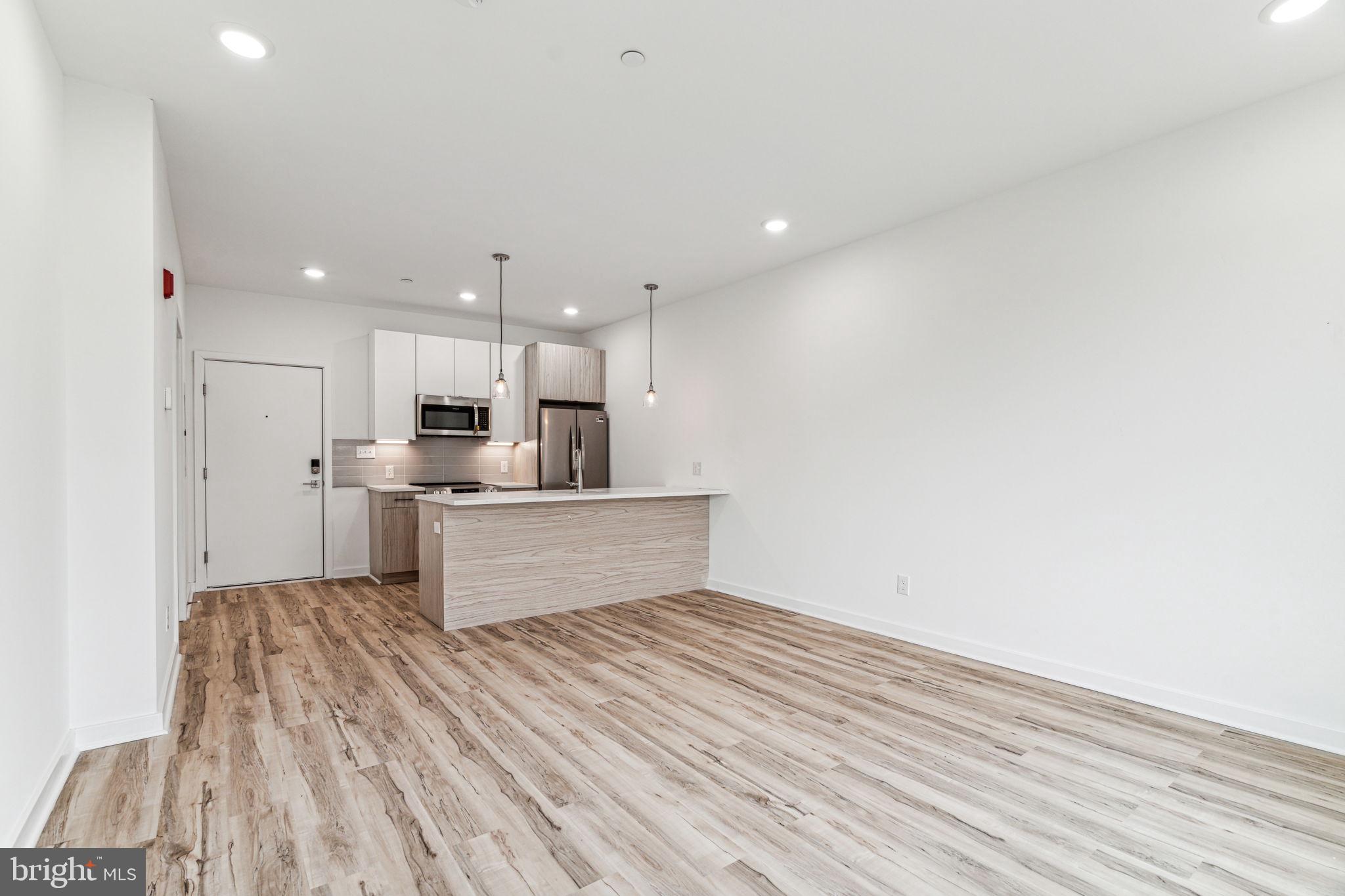 a view of kitchen with wooden floor