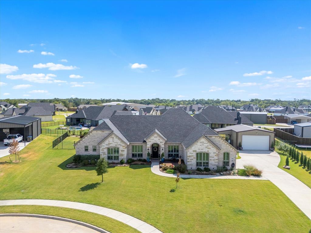 an aerial view of a house with swimming pool