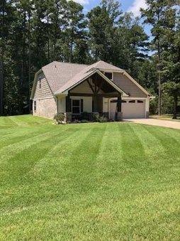 a house with a yard in front of it