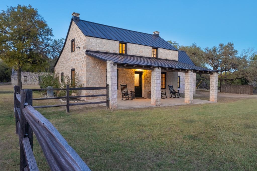 a view of a house with backyard and porch