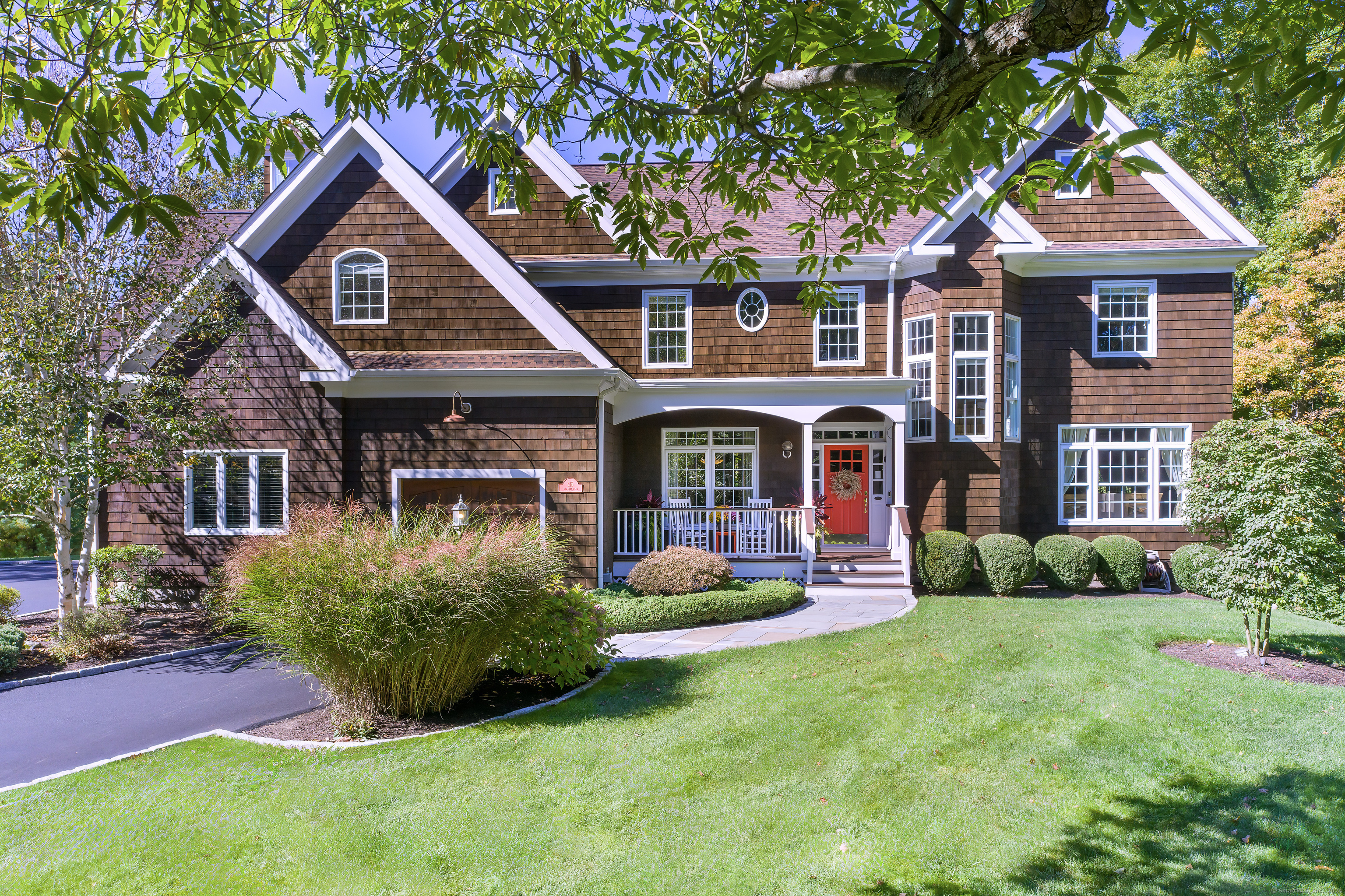 a front view of a house with garden