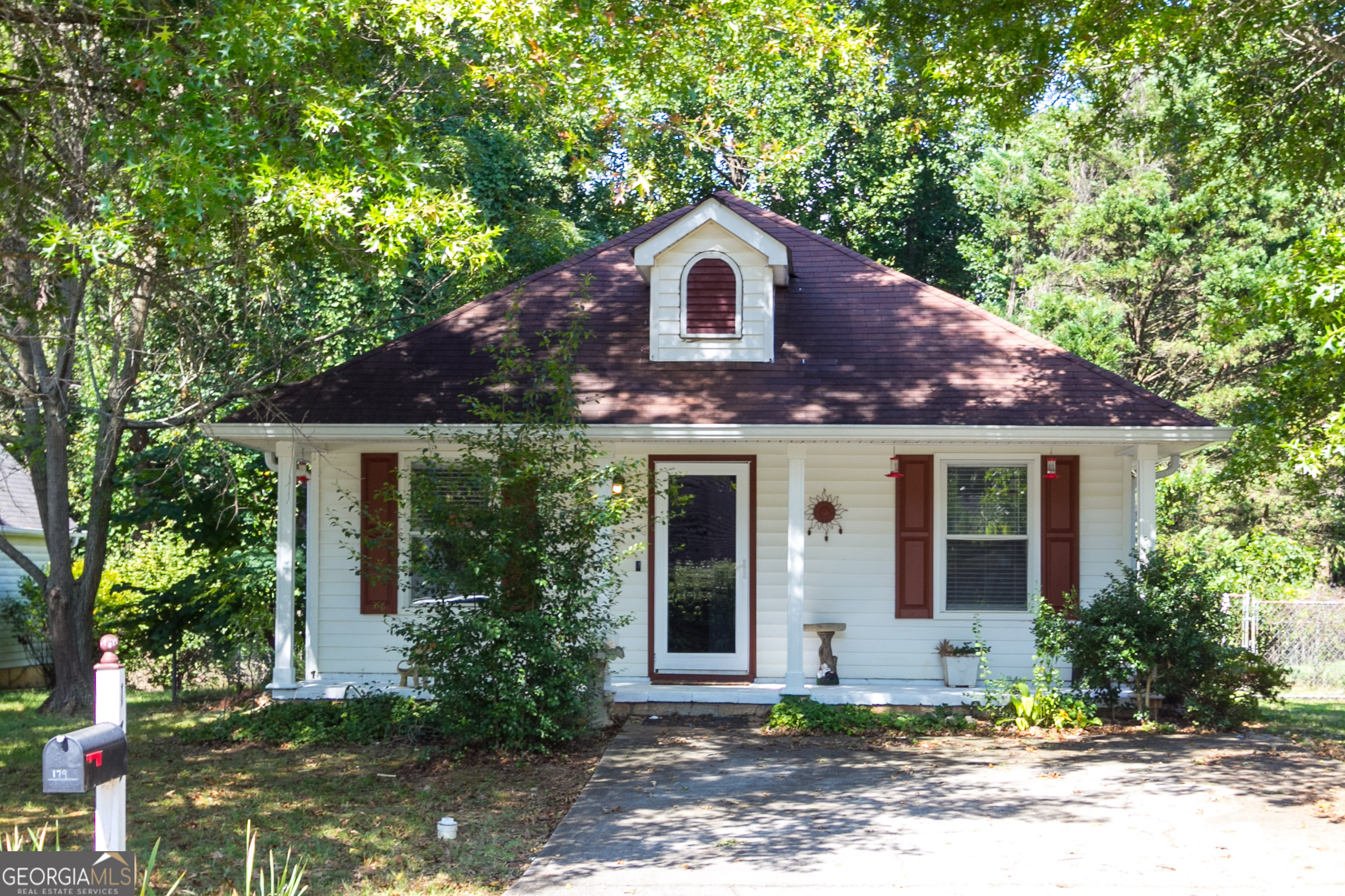 a front view of a house with garden