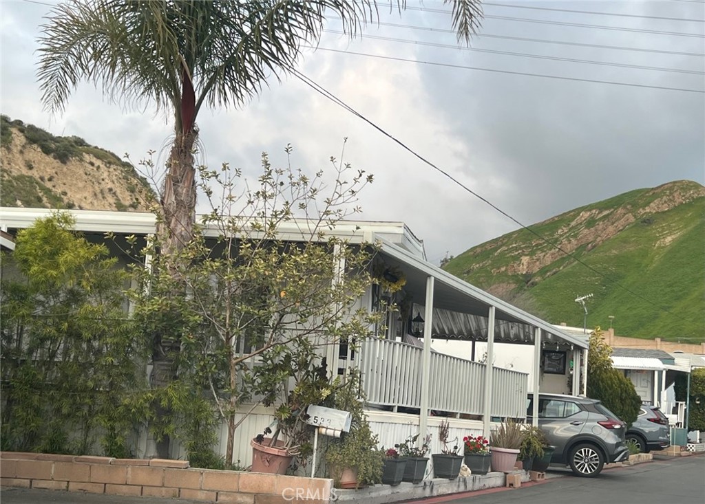 a view of a tall building next to a road