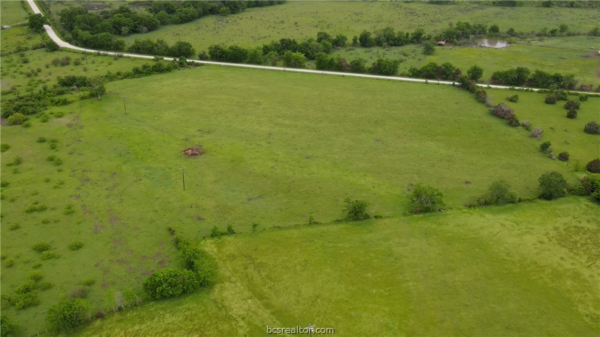 a view of a big yard with an outdoor space