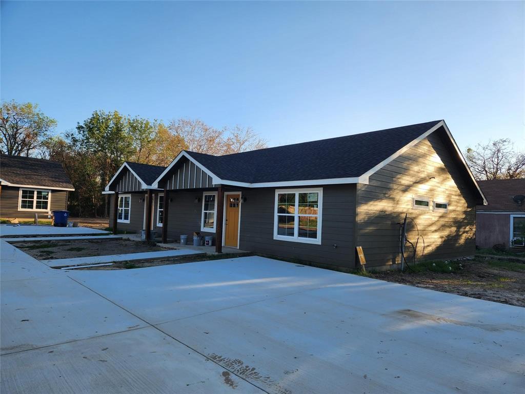 a view of house with yard