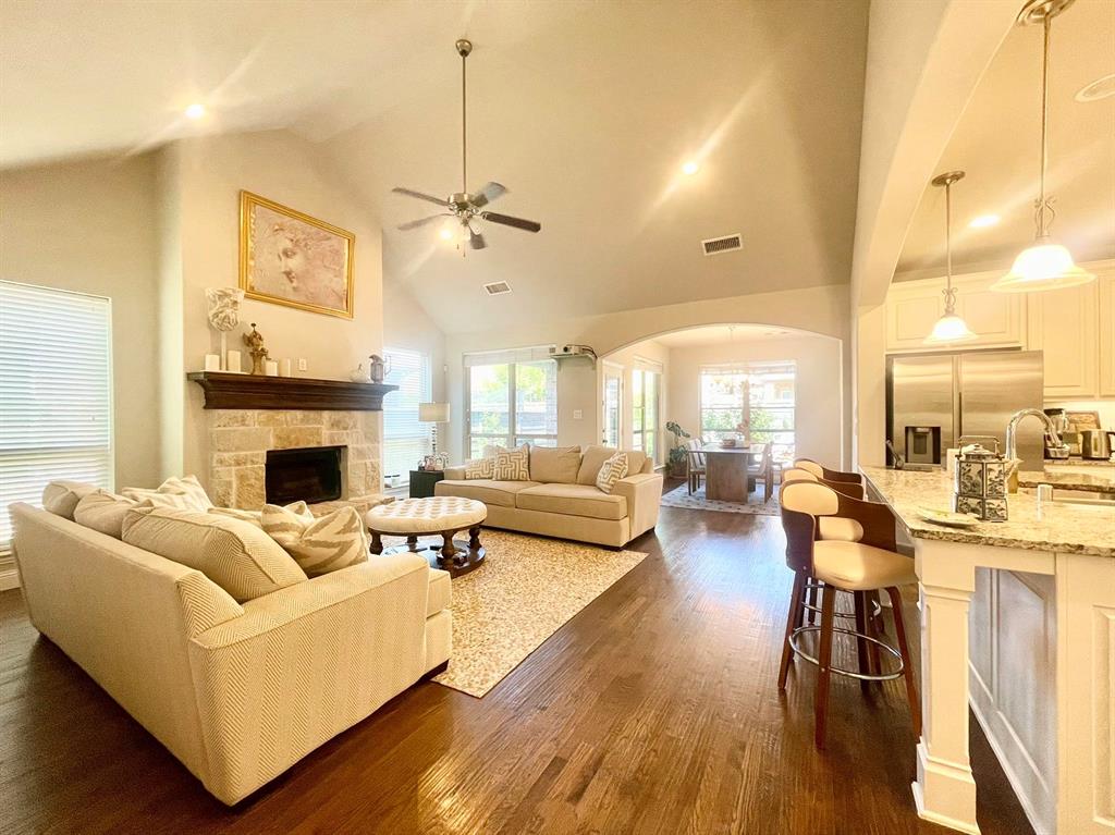 a living room with furniture fireplace and a chandelier