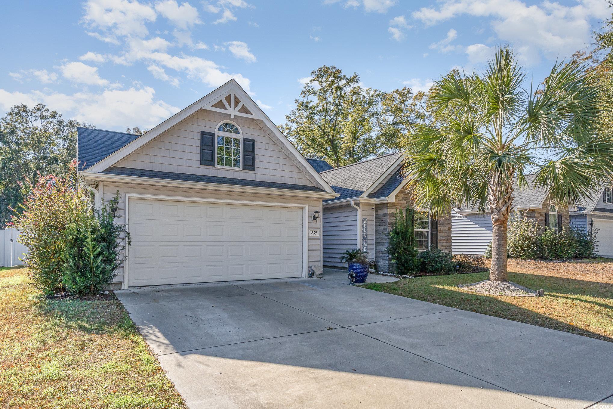 View of front of house featuring a front lawn and