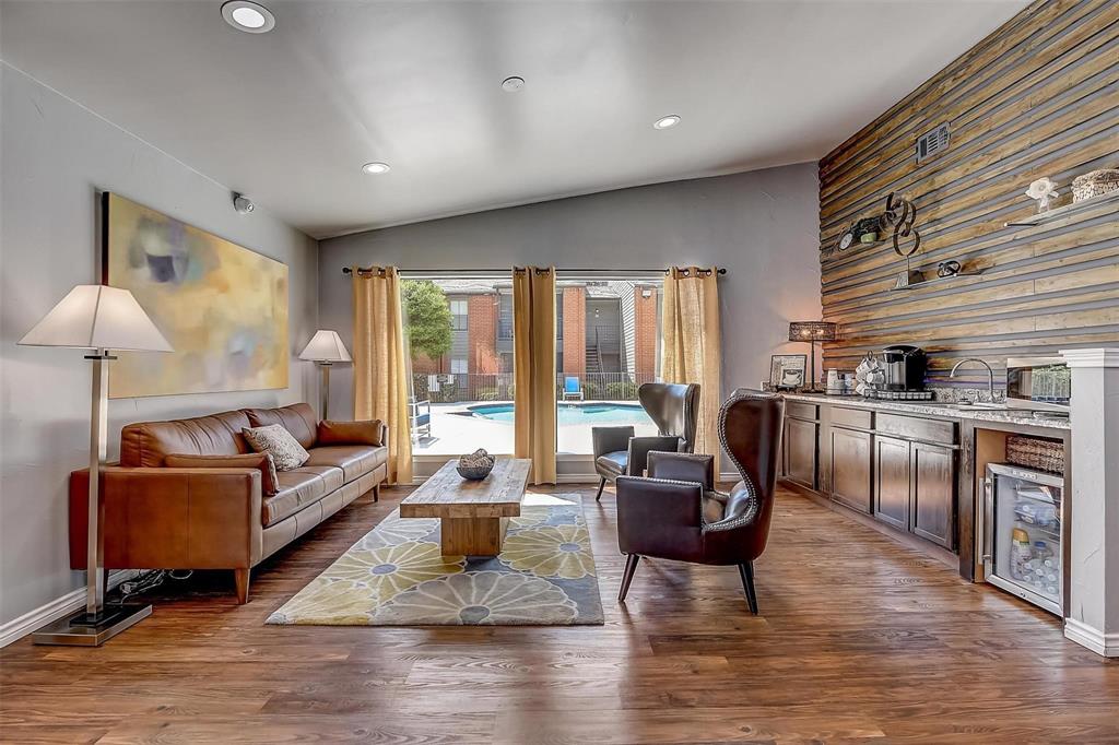 a living room with furniture window and wooden floor