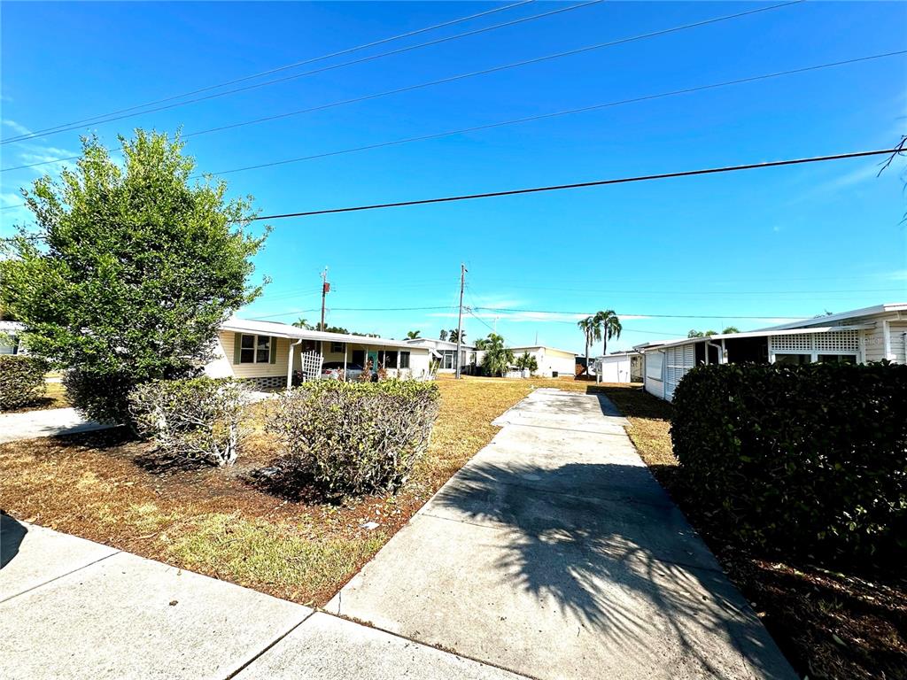 a view of a yard and front view of a house