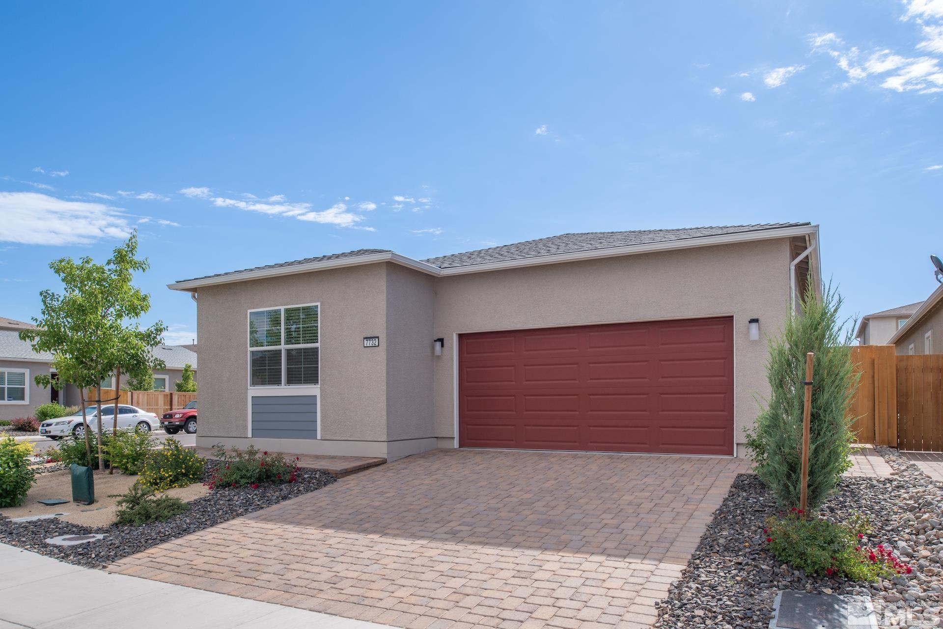 a front view of house with garage and yard